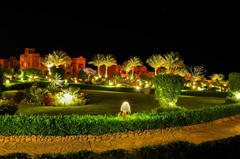 hotel garden by night with impressive landscape lighting