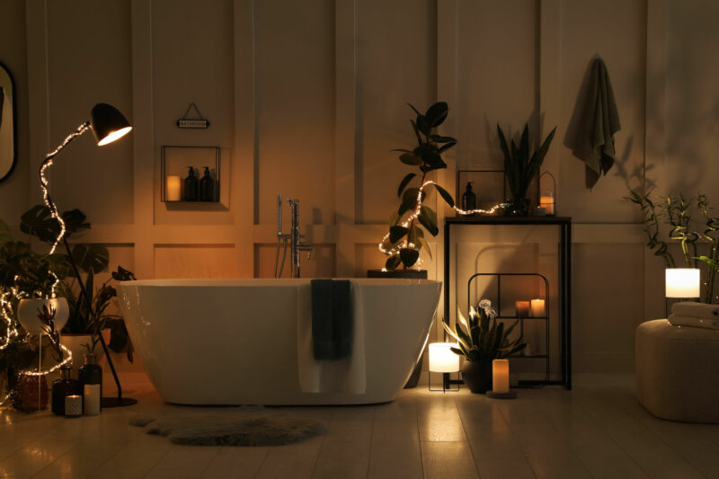 bathtub with different background lights and candles