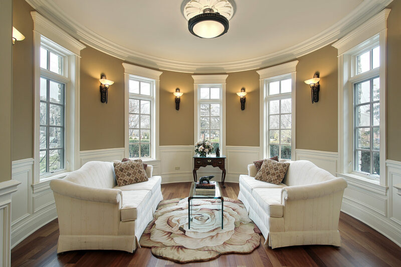 living room with ceiling light and wall sconces