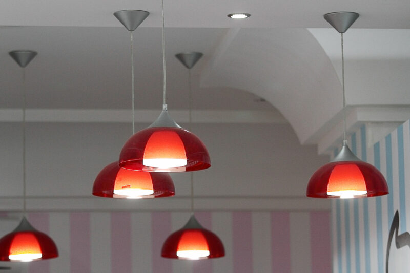 red pendant lights on foyer ceiling