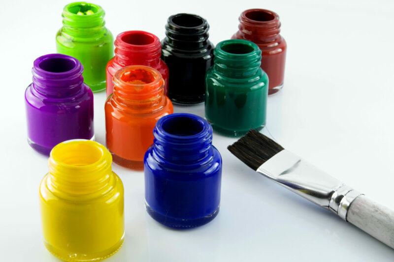 glass paint pots with a brush