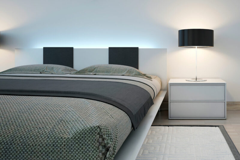 bed with LED strip on headboard