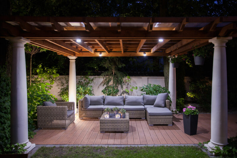 outdoor living area with cozy lighting
