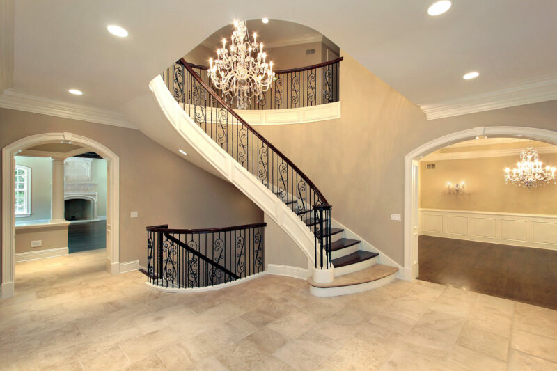 pendant lighting in hall with staircase