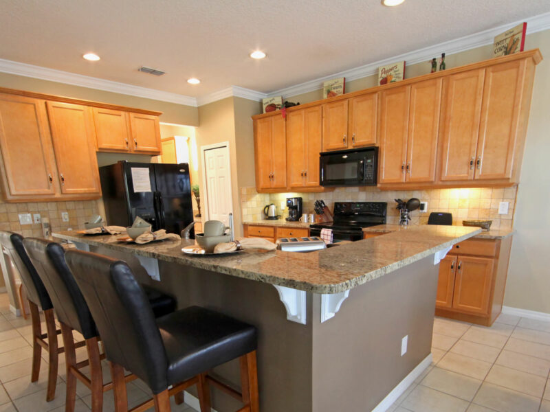 kitchen with dining table and recessed lights